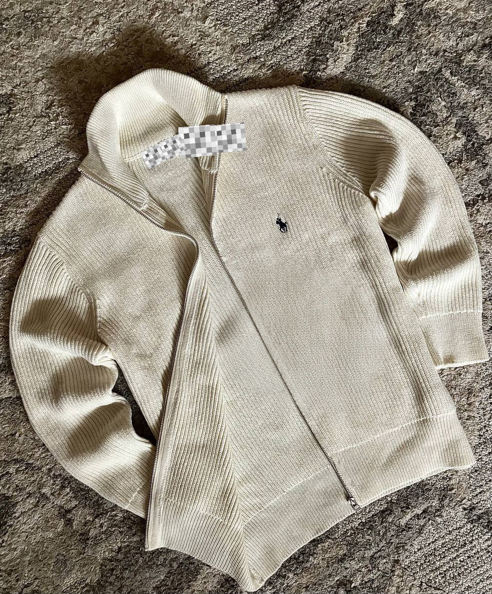 Sweater features a full zip