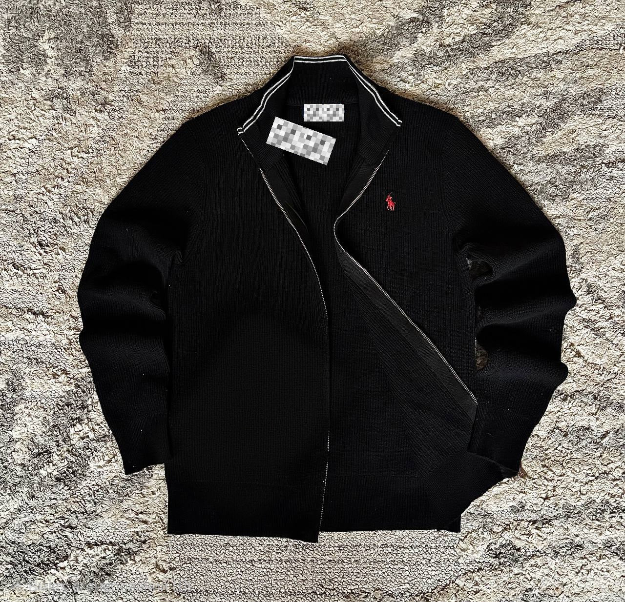 Sweater features a full zip