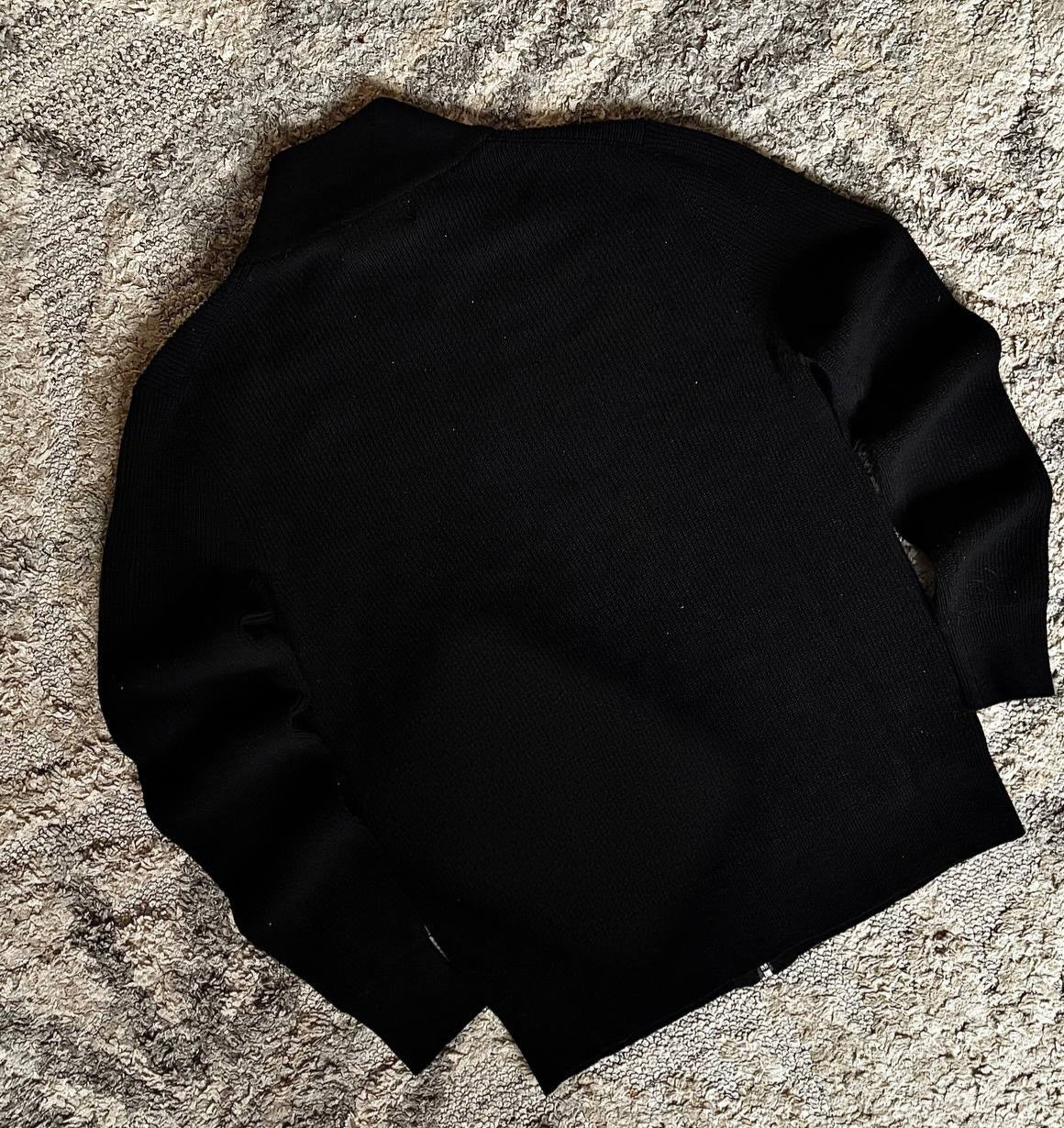 Sweater features a full zip
