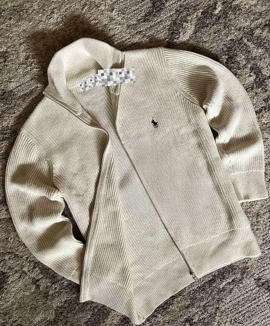 Sweater features a full zip