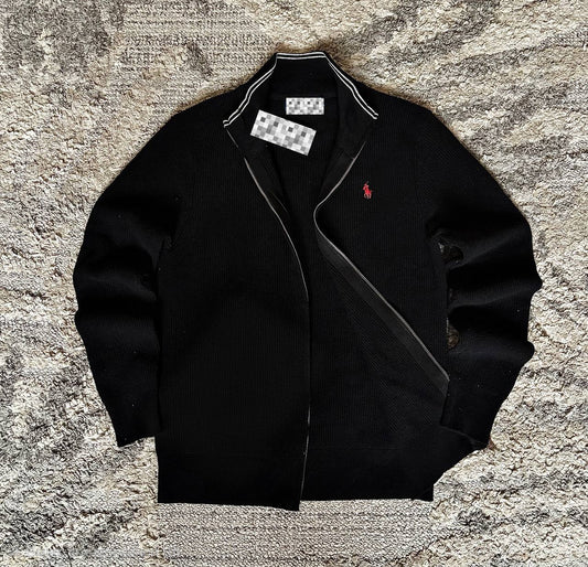Sweater features a full zip